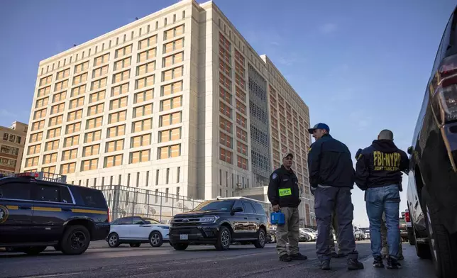 FILE - Federal enforcement officers stand outside the Metropolitan Detention Center, where Sean "Diddy" Combs is incarcerated on Oct. 28, 2024, in the Brooklyn Borough of New York. (AP Photo/Yuki Iwamura, File)