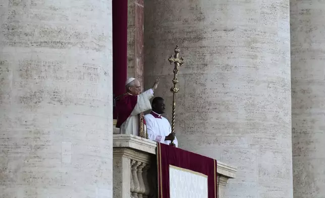 Pope Leo XIV appears on the balcony of St Peter's Basilica after his election, at the Vatican, Thursday, May 8, 2025. (AP Photo/Gregorio Borgia)