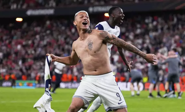 Tottenham's Richarlison celebrates after winning the Europa League final soccer match between against Manchester United at the San Mames Stadium in Bilbao, Spain, Wednesday, May 21, 2025. (AP Photo/Manu Fernandez)