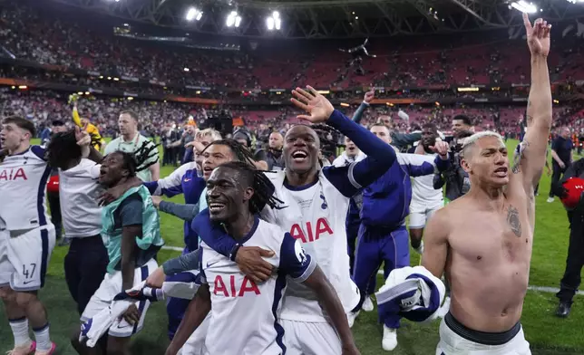Tottenham players celebrate their victory after the Europa League final soccer match between Tottenham Hotspur and Manchester United at the San Mamés Stadium in Bilbao, Spain, Wednesday, May 21, 2025. (AP Photo/Jose Breton)