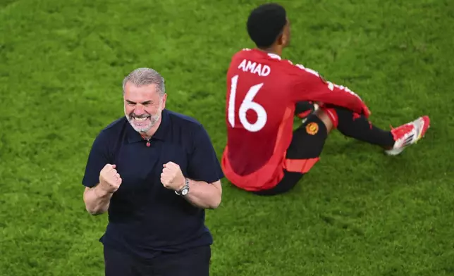 Tottenham's head coach Ange Postecoglou celebrates after the Europa League final soccer match between Tottenham Hotspur and Manchester United at the San Mamés Stadium in Bilbao, Spain, Wednesday, May 21, 2025. (AP Photo/Miguel Oses)