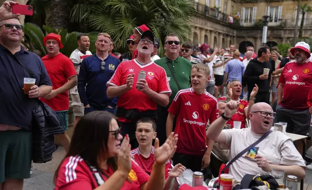 Manchester United supporters react ahead of the Europa League final soccer match between Tottenham Hotspur and Manchester United at the San Mamés Stadium in Bilbao, Spain, Wednesday, May 21, 2025. (AP Photo/Manu Fernandez)