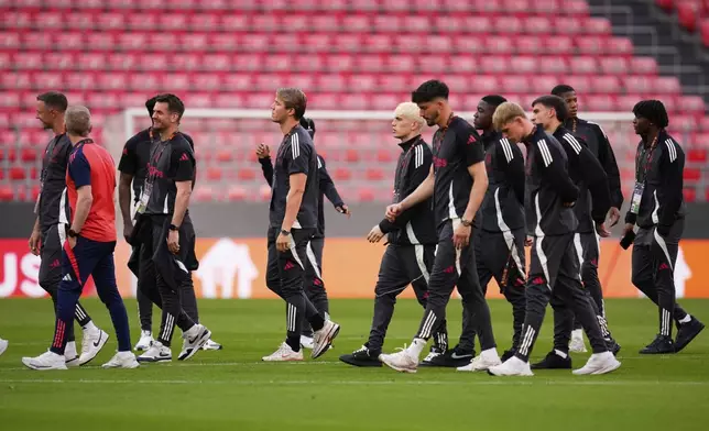 Manchester United players visit the pitch ahead of the Europa League final soccer match against Tottenham Hotspur at the San Mames Stadium in Bilbao, Spain, Tuesday, May 20, 2025. (AP Photo/Manu Fernandez)