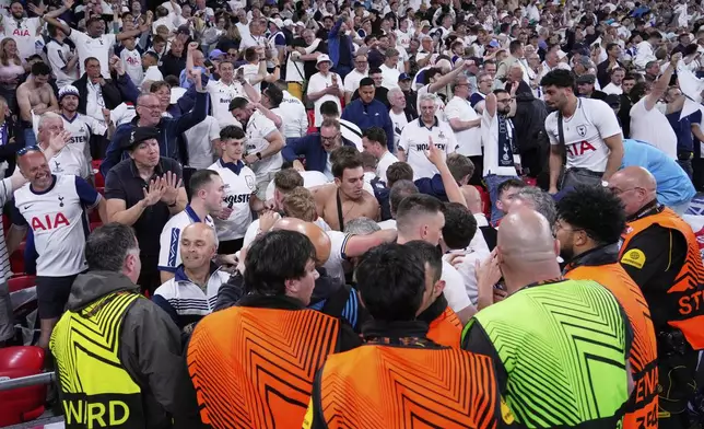 Tottenham fans celebrate the opening goal of their team during the Europa League final soccer match between Tottenham Hotspur and Manchester United at the San Mamés Stadium in Bilbao, Spain, Wednesday, May 21, 2025. (AP Photo/Jose Breton)