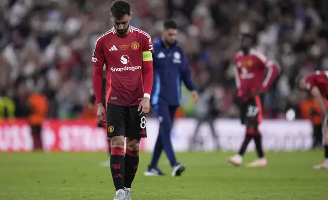 Manchester United's Bruno Fernandes react at the end of the Europa League final soccer match between Tottenham Hotspur and Manchester United at the San Mames Stadium in Bilbao, Spain, Wednesday, May 21, 2025. (AP Photo/Bernat Armangue)