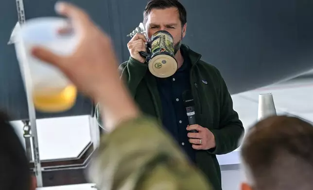 U.S. Vice President JD Vance gives a toast to U.S. service members during a refueling stop at Ramstein Air Base, Germany while en route to Joint Base Andrews, Md., Thursday April 24, 2025. (Kenny Holston/Pool Photo via AP)