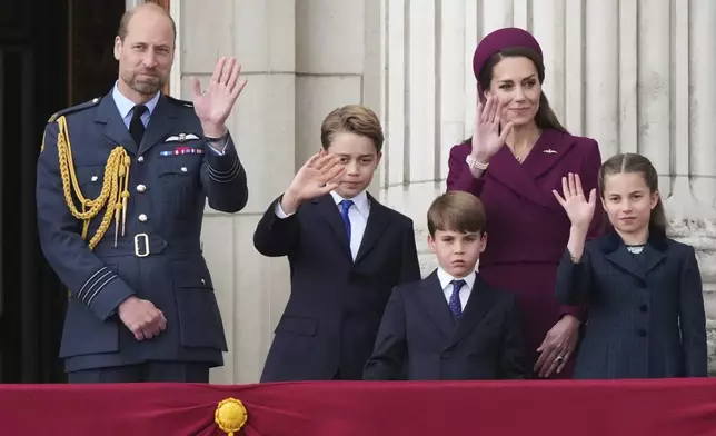 Britain's William, Prince of Wales, left, Prince George, second left, Prince Louis, center, Kate, Princess of Wales, second right, and Princess Charlotte, right, waves as they appear on the balcony of Buckingham Palace to watch the flypast during the V-E Day 80th anniversary parade in London, Monday, May 5, 2025. (AP Photo/Frank Augstein)