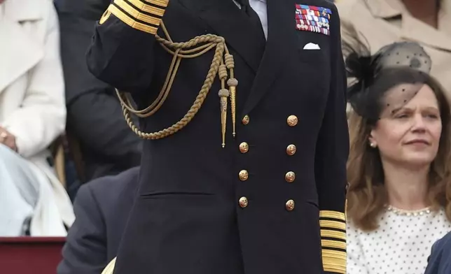 Britain's King Charles III salutes as he attends the military procession marking the 80th anniversary of VE Day, in London, Monday, May 5, 2025. (Toby Melville/Pool Photo via AP)