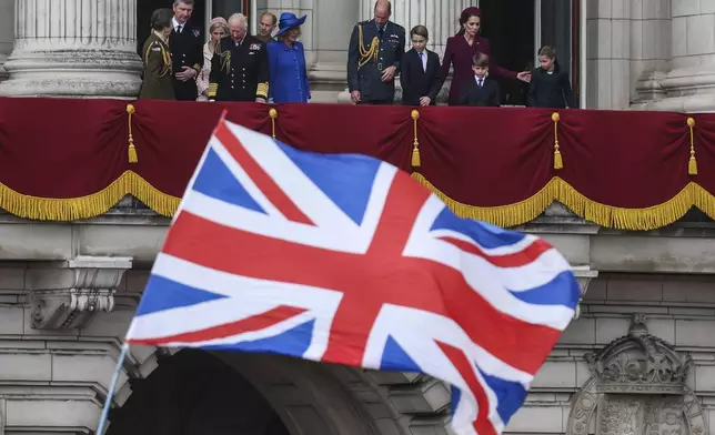 Members of the royal family on the balcony of Buckingham Palace to view the fly past featuring the Royal Air Force's Red Arrows after a military procession marking the 80th anniversary of V-E Day, in London, Monday, May 5, 2025. (Toby Melville/Pool Photo via AP)