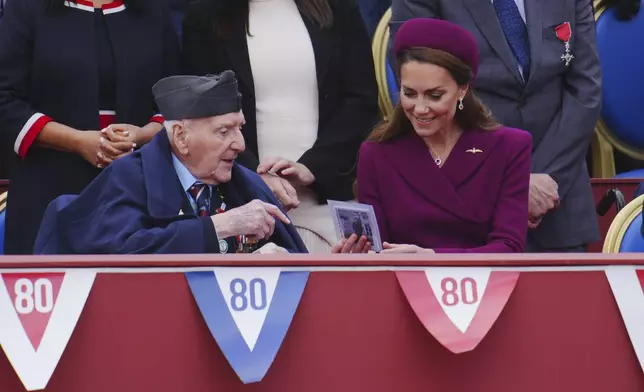 Britain's Kate, Princess of Wales speaks to veteran Bernard Morgan during the military procession marking the 80th anniversary of VE Day, in London, Monday, May 5, 2025. (Ben Birchall/Pool Photo via AP)