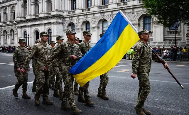 Ukrainian soldiers march past the Cenotaph, in Whitehall, during the VE Day 80th anniversary parade, in London, Monday, May 5, 2025. (Benjamin Cremel/Pool Photo via AP)