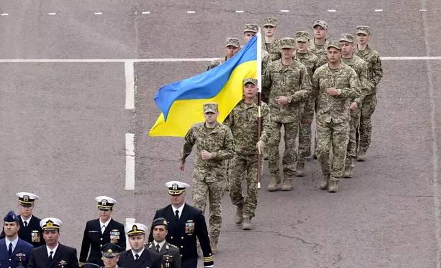 Members of the Ukrainian Armed Forces march, during the VE Day 80th anniversary parade, in London, Monday, May 5, 2025. (Andrew Matthews/Pool Photo via AP)