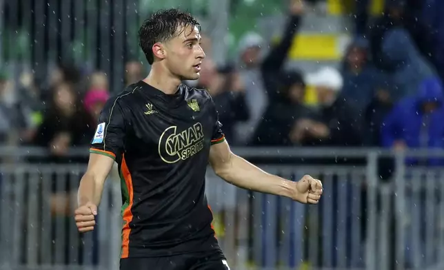 Venezia's Gaetano Oristanio celebrates after scoring his side's second goal during the Serie A soccer match between Venezia and Fiorentina in Venice, Italy, Monday, May 12, 2025. (Paola Garbuio/LaPresse via AP)