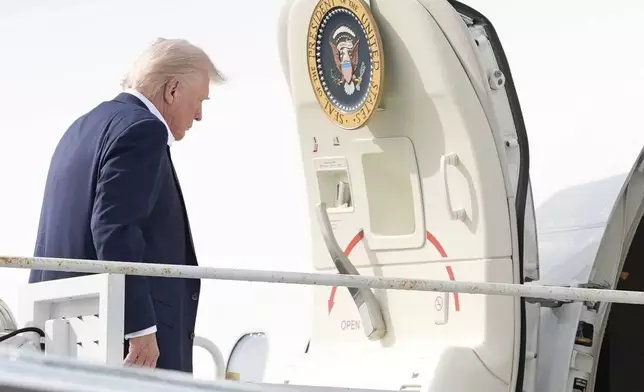 President Donald Trump boards Air Force One at Palm Beach International Airport, Sunday, May 4, 2025, in West Palm Beach, Fla. (AP Photo/Manuel Balce Ceneta)