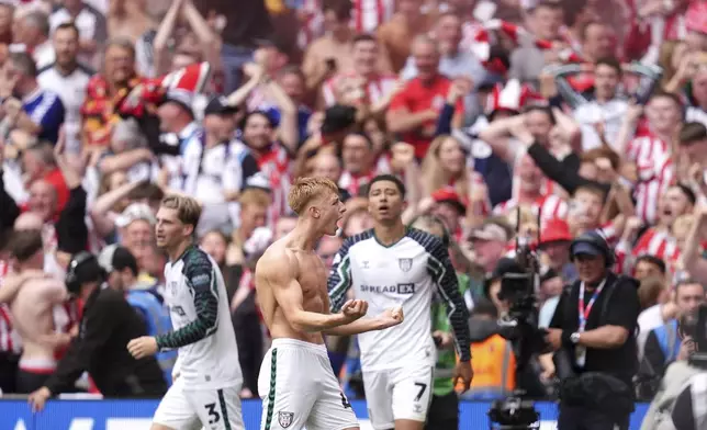 Sunderland's Tom Watson celebrates scoring his side's second goal during the Sky Bet Championship play off final between Sheffield United and Sunderland, at Wembley Stadium, London, Saturday May 24, 2025. (John Walton/PA via AP)