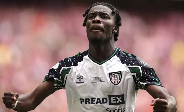 Sunderland's Eliezer Mayenda celebrates scoring his side's first goal during the Sky Bet Championship play off final between Sheffield United and Sunderland, at Wembley Stadium, London, Saturday May 24, 2025. (John Walton/PA via AP)