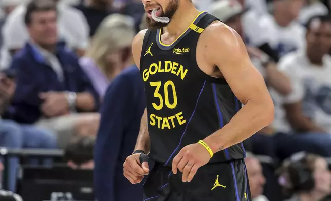 Stephen Curry (30) heads back to the bench in the first half as the Golden State Warriors played the Minnesota Timberwolves in Game 1 of the Second Round of the NBA Playoffs at Target Center in Minneapolis, Minn., on Tuesday, May 6, 2025. ( Carlos Avila Gonzalez/San Francisco Chronicle via AP)