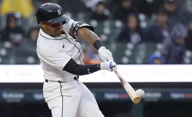 Detroit Tigers' Andy Ibáñez hits a fly ball for an out against the Cleveland Guardians during the sixth inning of a baseball game Thursday, May 22, 2025, in Detroit. (AP Photo/Duane Burleson)