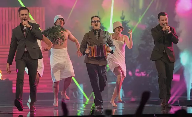 KAJ from Sweden performs the song "Bara Bada Bastu" during the first semi-final of the 69th Eurovision Song Contest, in Basel, Switzerland, Tuesday, May 13, 2025. (AP Photo/Martin Meissner)