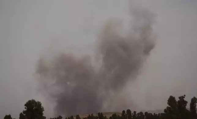 Smoke rises following an Israeli airstrike in the Gaza Strip, as seen from southern Israel, Thursday, May 15, 2025. (AP Photo/Ariel Schalit)