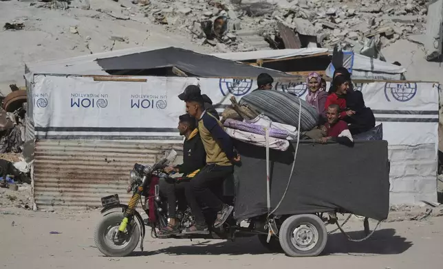 Displaced Palestinians fleeing Beit Lahia amid ongoing Israeli military operations in the Gaza Strip arrive in Jabalia, northern Gaza, on Friday, May 16, 2025. (AP Photo/Jehad Alshrafi)