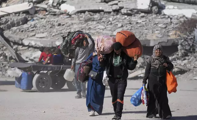 Displaced Palestinians fleeing Beit Lahia amid ongoing Israeli military operations in the Gaza Strip arrive in Jabalia, northern Gaza, on Friday, May 16, 2025. (AP Photo/Jehad Alshrafi)