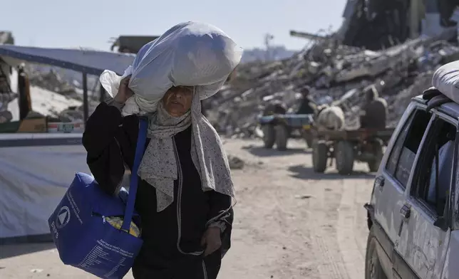 Displaced Palestinians fleeing Beit Lahia amid ongoing Israeli military operations in the Gaza Strip arrive in Jabalia, northern Gaza, on Friday, May 16, 2025. (AP Photo/Jehad Alshrafi)