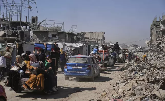 Displaced Palestinians fleeing Beit Lahia amid ongoing Israeli military operations in the Gaza Strip arrive in Jabalia, northern Gaza, on Friday, May 16, 2025. (AP Photo/Jehad Alshrafi)