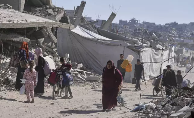 Displaced Palestinians fleeing Beit Lahia amid ongoing Israeli military operations in the Gaza Strip arrive in Jabalia, northern Gaza, on Friday, May 16, 2025. (AP Photo/Jehad Alshrafi)