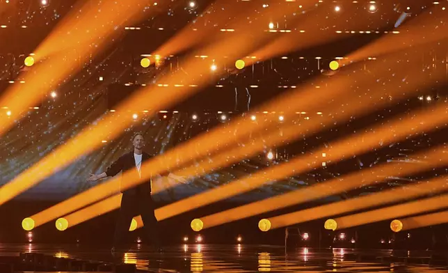 Klemen from Slovenia performs the song "How Much Time Do We Have Left" during the first semi-final of the 69th Eurovision Song Contest, in Basel, Switzerland, Tuesday, May 13, 2025. (AP Photo/Martin Meissner)