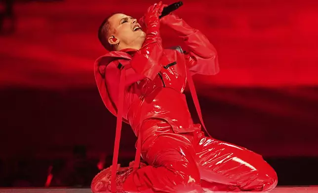 Red Sebastian from Belgium performs the song "Strobe Lights" during the first semi-final of the 69th Eurovision Song Contest, in Basel, Switzerland, Tuesday, May 13, 2025. (AP Photo/Martin Meissner)
