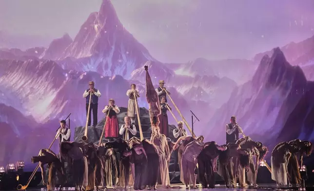 Traditional Swiss mountain horns open the show ahead of the start of the first semi-final of the 69th Eurovision Song Contest, in Basel, Switzerland, Tuesday, May 13, 2025. (AP Photo/Martin Meissner)