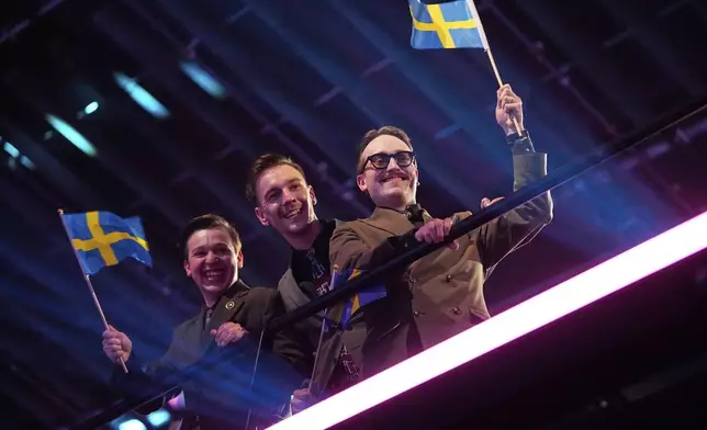 KAJ from Sweden who performed "Bara Bada Bastu" celebrate after progressing through the first semi-final to the final of the 69th Eurovision Song Contest,in Basel, Switzerland, Tuesday, May 13, 2025. (AP Photo/Martin Meissner)