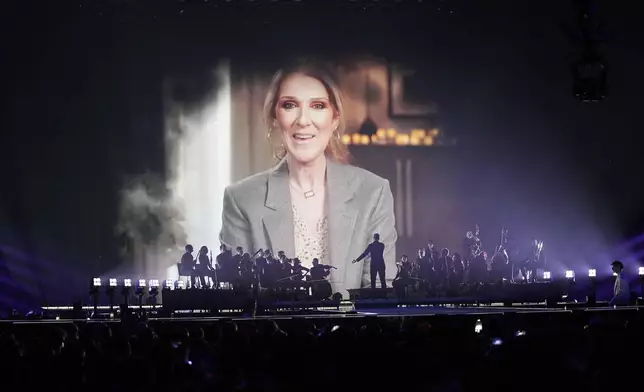 Former Eurovision Song Contest winner Celine Dion, speak in a pre-recorded video message during the first semi-final of the 69th Eurovision Song Contest, in Basel, Switzerland, Tuesday, May 13, 2025. (AP Photo/Martin Meissner)