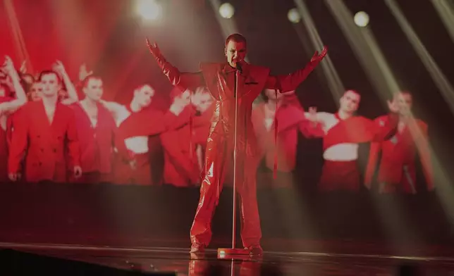 Red Sebastian from Belgium performs the song "Strobe Lights" during the first semi-final of the 69th Eurovision Song Contest, in Basel, Switzerland, Tuesday, May 13, 2025. (AP Photo/Martin Meissner)