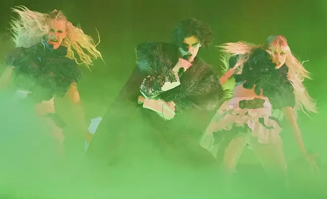 Marko Bosnjak from Croatia performs the song "Poison Cake" during the first semi-final of the 69th Eurovision Song Contest, in Basel, Switzerland, Tuesday, May 13, 2025. (AP Photo/Martin Meissner)