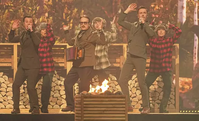 KAJ from Sweden performs the song "Bara Bada Bastu" during the first semi-final of the 69th Eurovision Song Contest, in Basel, Switzerland, Tuesday, May 13, 2025. (AP Photo/Martin Meissner)