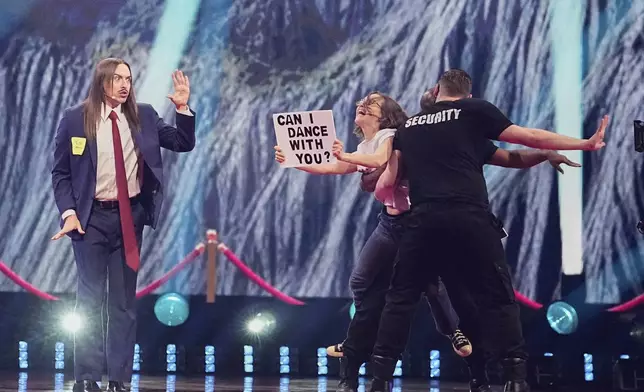 Tommy Cash from Estonia performs the song "Espresso Macchiato" during the first semi-final of the 69th Eurovision Song Contest, in Basel, Switzerland, Tuesday, May 13, 2025. (AP Photo/Martin Meissner)