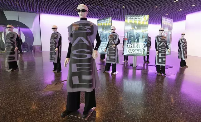 An art installation welcomes music fans at the Eurovision village ahead of the first semi-final of the 69th Eurovision Song Contest, in Basel, Switzerland, Tuesday, May 13, 2025. (AP Photo/Martin Meissner)