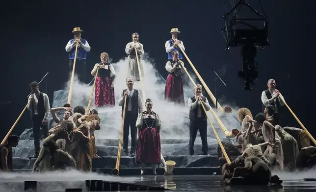 Traditional Swiss mountain horns open the show ahead of the start of the first semi-final of the 69th Eurovision Song Contest, in Basel, Switzerland, Tuesday, May 13, 2025. (AP Photo/Martin Meissner)