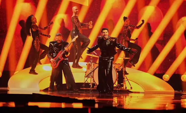 Mamagama from Azerbaijan performs the song "Run With U" during the first semi-final of the 69th Eurovision Song Contest, in Basel, Switzerland, Tuesday, May 13, 2025. (AP Photo/Martin Meissner)