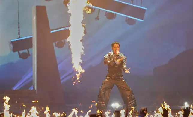 Kyle Alessandro from Norway performs the song "Lighter" during the first semi-final of the 69th Eurovision Song Contest, in Basel, Switzerland, Tuesday, May 13, 2025. (AP Photo/Martin Meissner)