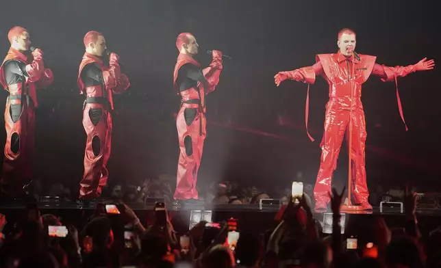 Red Sebastian from Belgium performs the song "Strobe Lights" during the first semi-final of the 69th Eurovision Song Contest, in Basel, Switzerland, Tuesday, May 13, 2025. (AP Photo/Martin Meissner)