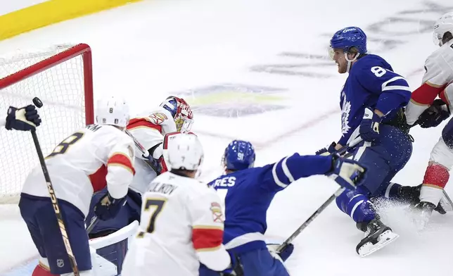 Toronto Maple Leafs forward William Nylander (88) scores against Florida Panthers goaltender Sergei Bobrovsky (72) during the first period of Game 1 in an NHL hockey second-round playoff series in Toronto, Monday, May 5, 2025. (Frank Gunn/The Canadian Press via AP)