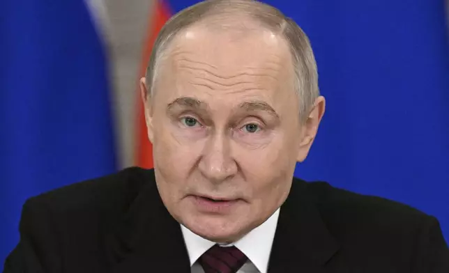 Russian President Vladimir Putin gestures as he speaks to journalists in the Grand Palace at the Kremlin in Moscow, Russia, Sunday, May 11, 2025, after celebrations of the 80th anniversary of the Soviet Union's victory over Nazi Germany during World War II. (Sergei Bobylev/Photo host agency RIA Novosti via AP)
