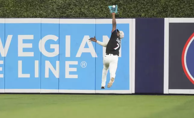 Miami Marlins outfielder Jesús Sánchez (7) catches a hit by Tampa Bay Rays' Ben Rortvedt during the ninth inning of a baseball game, Friday, May 16, 2025, in Miami. (AP Photo/Marta Lavandier)