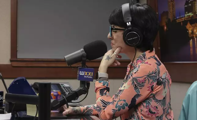 Jasmin Singer hosts her radio show, "Environmental Connections," on Friday, March 28, 2025, in Rochester, N.Y. (Toni Duncan via AP)