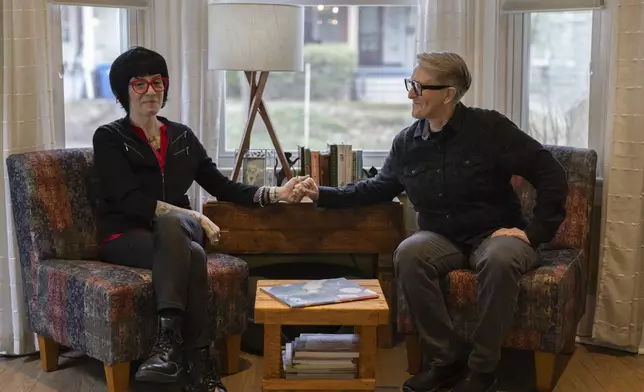 Jasmin Singer, left, and Moore Rhys, right, pose for a portrait on Saturday, March 22, 2025, in Rochester, N.Y. (Toni Duncan via AP)