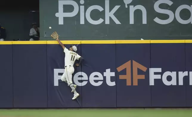 Milwaukee Brewers outfielder Jackson Chourio (11) catches a ball hit by Minnesota Twins' Royce Lewis during the eighth inning of a baseball game, Sunday, May 18, 2025, in Milwaukee. (AP Photo/Jeffrey Phelps)