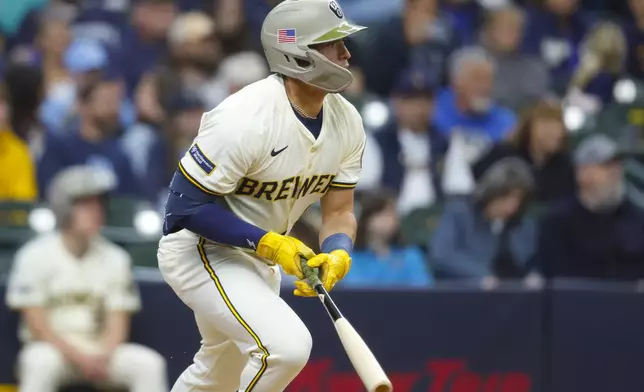 Milwaukee Brewers' Isaac Collins watches his two-RBI single against the Minnesota Twins during the third inning of a baseball game, Sunday, May 18, 2025, in Milwaukee. (AP Photo/Jeffrey Phelps)